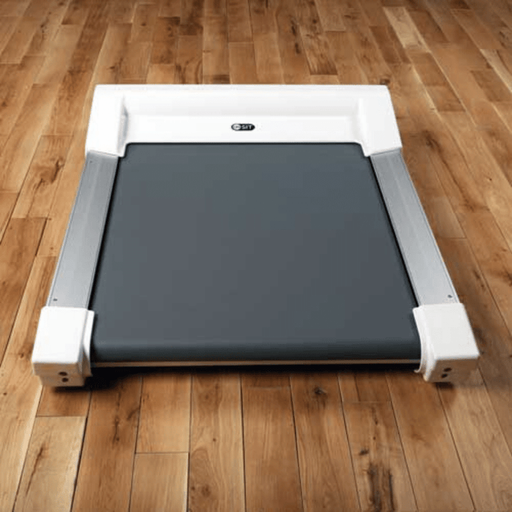 A photo of the Unsit treadmill sitting on a hardwood floor